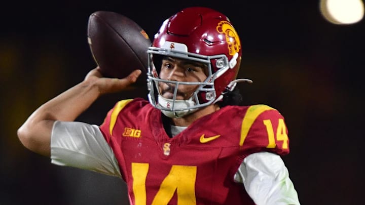 Nov 7, 2025; Los Angeles, California, USA; Southern California Trojans quarterback Jayden Maiava (14) throws against the Northwestern Wildcats during the second half at the Los Angeles Memorial Coliseum. Mandatory Credit: Gary A. Vasquez-Imagn Images