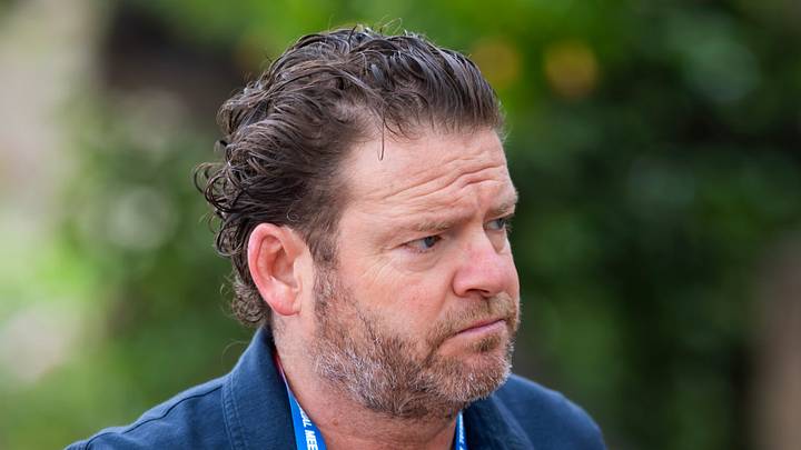 Seattle Seahawks general manager John Schneider walks into the office