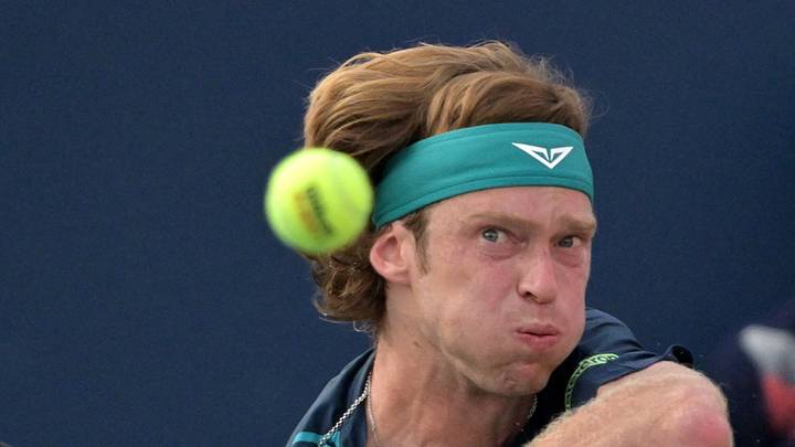 Andrey Rublev hits a backhand Andrey Rublev hits a backhand