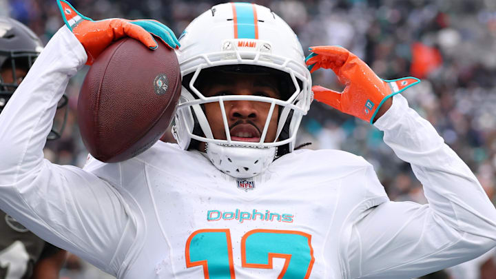 Dec 7, 2025; East Rutherford, New Jersey, USA; Miami Dolphins wide receiver Jaylen Waddle (17) reacts after making a catch for a touchdown against the New York Jets during the first half at MetLife Stadium. Mandatory Credit: Ed Mulholland-Imagn Images