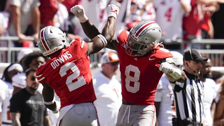 Ohio State Buckeyes safety Caleb Downs (2) and linebacker Arvell Reese (8)