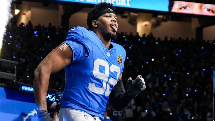 Detroit Lions defensive end Marcus Davenport (92) runs onto the field for players introduction before the Thanksgiving game