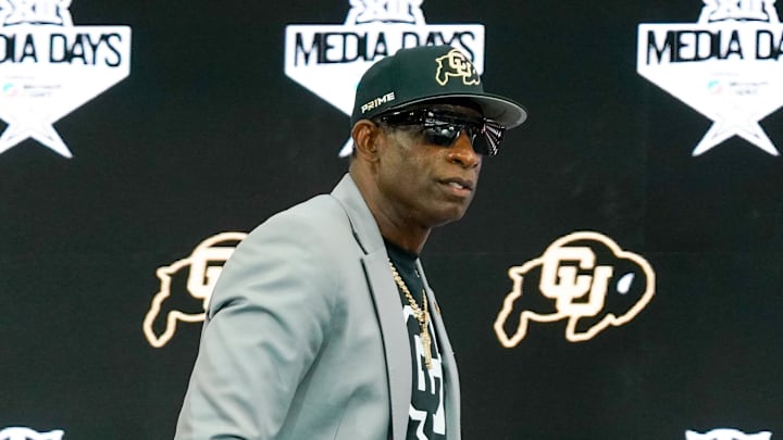Jul 9, 2025; Frisco, TX, USA; Colorado head coach Deion Sanders walks onto the stage during 2025 Big 12 Football Media Days at The Star. Mandatory Credit: Raymond Carlin III-Imagn Images