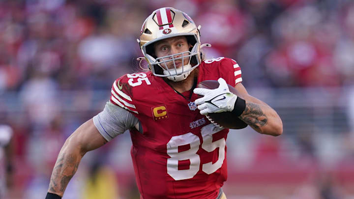 Dec 8, 2024; Santa Clara, California, USA; San Francisco 49ers tight end George Kittle (85) runs with the ball after making a catch against the Chicago Bears in the second quarter at Levi's Stadium. Mandatory Credit: Cary Edmondson-Imagn Images