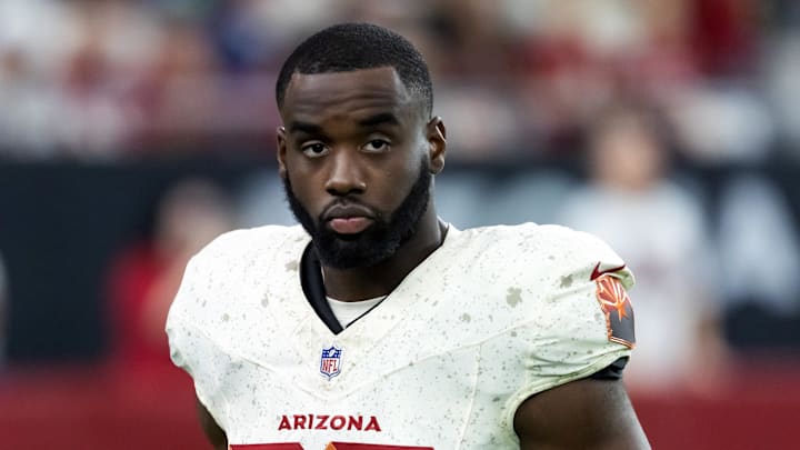 Sep 25, 2025; Glendale, Arizona, USA; Arizona Cardinals running back Trey Benson (33) against the Seattle Seahawks at State Farm Stadium. Mandatory Credit: Mark J. Rebilas-Imagn Images