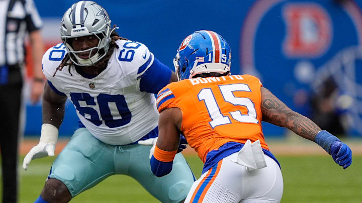 October 26, 2025: Dallas Cowboys offensive tackle Tyler Guyton (60) sets to block Denver Broncos linebacker Nik Bonitto (15) before the football game between the Denver Broncos and Dallas Cowboys. 