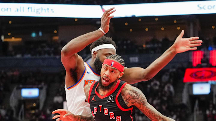 Toronto Raptors forward Brandon Ingram dribbles against New York Knicks center Mitchell Robinson. Toronto Raptors forward Brandon Ingram dribbles against New York Knicks center Mitchell Robinson.