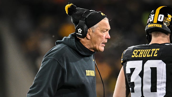 Nov 29, 2024; Iowa City, Iowa, USA; Iowa Hawkeyes head coach Kirk Ferentz reacts as defensive back Quinn Schulte (30) looks on during the first quarter against the Nebraska Cornhuskers at Kinnick Stadium. Mandatory Credit: Jeffrey Becker-Imagn Images Nov 29, 2024; Iowa City, Iowa, USA; Iowa Hawkeyes head coach Kirk Ferentz reacts as defensive back Quinn Schulte (30) looks on during the first quarter against the Nebraska Cornhuskers at Kinnick Stadium. Mandatory Credit: Jeffrey Becker-Imagn Images