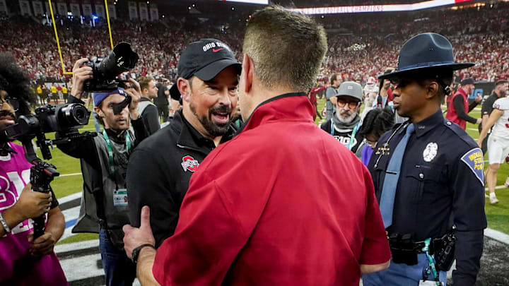 Ohio State Buckeyes head coach Ryan Day and Indiana Hoosiers head coach Curt Cignetti shake hands Sunday, Dec. 7, 2025, after the Big Ten football championship at Lucas Oil Stadium in Indianapolis. Ohio State Buckeyes head coach Ryan Day and Indiana Hoosiers head coach Curt Cignetti shake hands Sunday, Dec. 7, 2025, after the Big Ten football championship at Lucas Oil Stadium in Indianapolis.