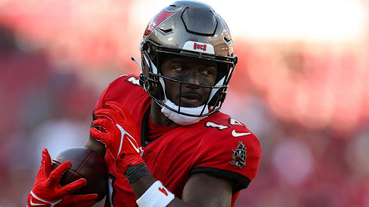Dec 31, 2023; Tampa, Florida, USA;  Tampa Bay Buccaneers wide receiver Chris Godwin (14) catches a pass for a touchdown against the New Orleans Saints in the fourth quarter at Raymond James Stadium. Mandatory Credit: Nathan Ray Seebeck-Imagn Images