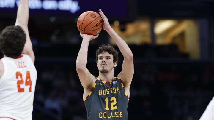 Mar 13, 2024; Washington, D.C., USA; Boston College Eagles forward Quinten Post (12) shoots the ball over Clemson Tigers center PJ Hall (24) in the first half at Capital One Arena. Mandatory Credit: Geoff Burke-USA TODAY Sports