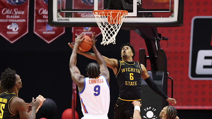 Nov 29, 2024; Orlando, Florida, USA; Florida Gators center Rueben Chinyelu (9) blocks a shot from Wichita State Shockers forward Corey Washington (6) in the first half at ESPN Wide World of Sports Complex. Mandatory Credit: Nathan Ray Seebeck-Imagn Images Nov 29, 2024; Orlando, Florida, USA; Florida Gators center Rueben Chinyelu (9) blocks a shot from Wichita State Shockers forward Corey Washington (6) in the first half at ESPN Wide World of Sports Complex. Mandatory Credit: Nathan Ray Seebeck-Imagn Images