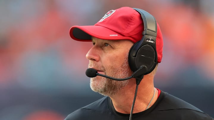 Nov 15, 2025; Miami Gardens, Florida, USA; NC State Wolfpack head coach Dave Doeren watches from the sideline against the Miami Hurricanes during the second quarter at Hard Rock Stadium. Mandatory Credit: Sam Navarro-Imagn Images