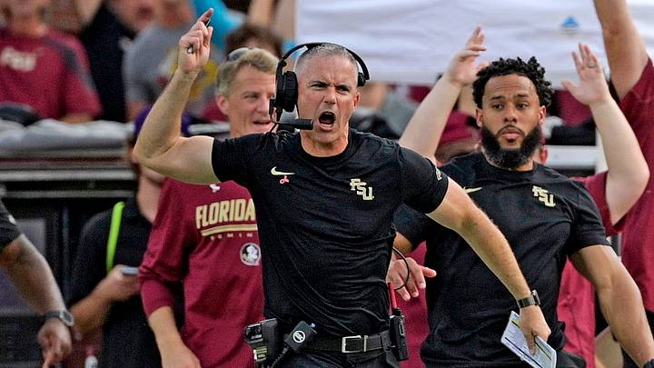Oct 3, 2026; Tallahassee, Florida, USA; Florida State Seminoles quarterback Ashton Daniels (14) runs for a touchdown as head coach Mike Norvell cheers on the sidelines during the second half against the Virginia Cavaliers at Doak S. Campbell Stadium. Mandatory Credit: Melina Myers-Imagn Images Oct 3, 2026; Tallahassee, Florida, USA; Florida State Seminoles quarterback Ashton Daniels (14) runs for a touchdown as head coach Mike Norvell cheers on the sidelines during the second half against the Virginia Cavaliers at Doak S. Campbell Stadium. Mandatory Credit: Melina Myers-Imagn Images