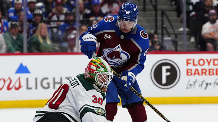 May 3, 2026; Denver, Colorado, USA; Colorado Avalanche left wing Artturi Lehkonen (62) shields Minnesota Wild goaltender Jesper Wallstedt (30) for a goal during the second period in game one of the second round of the 2026 Stanley Cup Playoffs at Ball Arena. Mandatory Credit: Ron Chenoy-Imagn Images