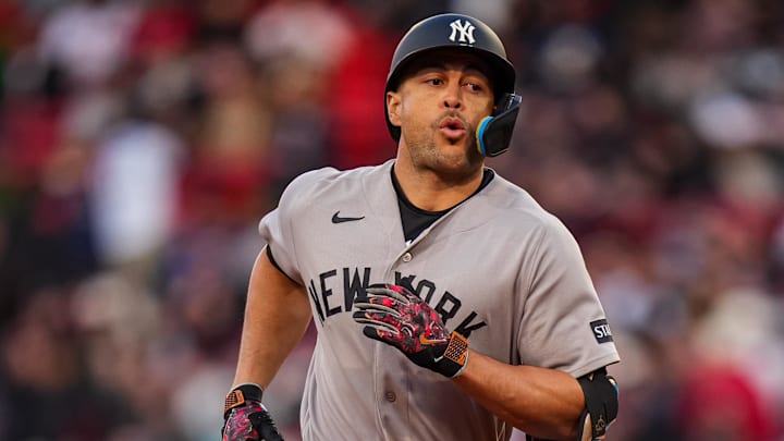 New York Yankees designated hitter Giancarlo Stanton (27) rounds the bases after hitting a home run against the Boston Red Sox in the second inning at Fenway Park.
