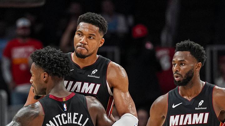 Oct 28, 2026; Atlanta, Georgia, USA; Miami Heat forward Giannis Antetokounmpo (7) and guard Davion Mitchell (2) react at the end of the game against the Atlanta Hawks at State Farm Arena. Mandatory Credit: Dale Zanine-Imagn Images