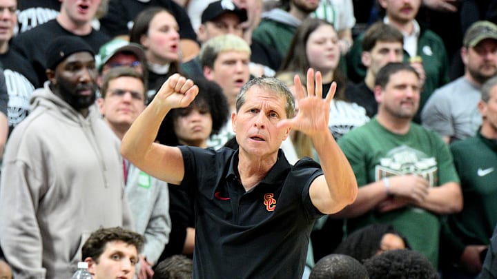 Jan 5, 2026; East Lansing, Michigan, USA;  Southern California Trojans head coach Eric Musselman sends in a play against the Michigan State Spartans during the first half at Jack Breslin Student Events Center. Mandatory Credit: Dale Young-Imagn Images