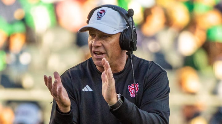 Oct 11, 2025; South Bend, Indiana, USA; NC State Wolfpack head coach Dave Doeren claps as he walks onto the field against the Notre Dame Fighting Irish during the second half at Notre Dame Stadium. Mandatory Credit: Michael Caterina-Imagn Images
