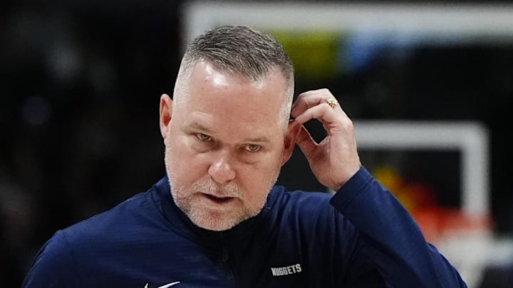 Mar 15, 2025; Denver, Colorado, USA; Denver Nuggets head coach Michael Malone following a timeout in the fourth quarter against the Washington Wizards at Ball Arena. Mandatory Credit: Ron Chenoy-Imagn Images