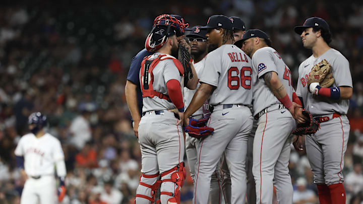 Mar 31, 2026; Houston, Texas, USA;  Boston Red Sox starting pitcher Brayan Bello (66) gets a mound visit against the Houston Astros in the fifth inning at Daikin Park. Mandatory Credit: Thomas Shea-Imagn Images
