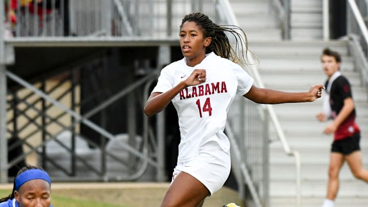 Alabama forward Gianna Paul (14) scores a goal past Georgia keeper Jordan Brown. Alabama and Georgia played to a 1-1 tie at the Alabama Soccer Stadium Thursday, Sept. 14, 2023.