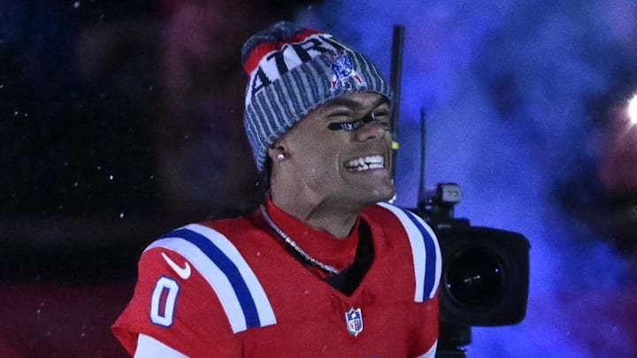 Dec 1, 2025; Foxborough, Massachusetts, USA; New England Patriots cornerback Christian Gonzalez (0) runs onto the field prior to the game against the New York Giants at Gillette Stadium.  
