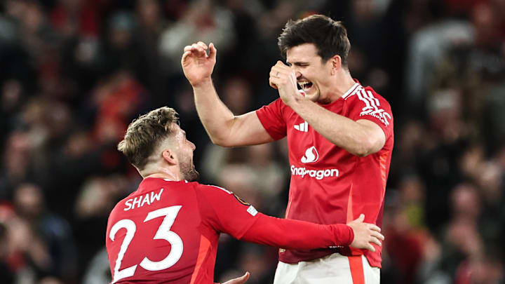 Luke Shaw and Harry Maguire (right) celebrated Manchester United's improbable victory.