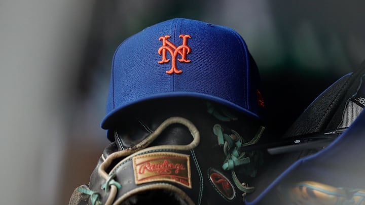 Aug 8, 2024; Denver, Colorado, USA; A New York Mets hat and glove in the dugout in the second inning against the Colorado Rockies at Coors Field. Mandatory Credit: Isaiah J. Downing-Imagn Images