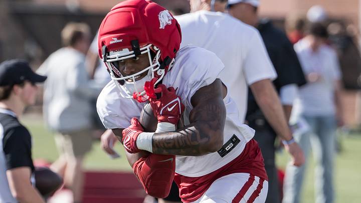 Arkansas Razorbacks wide receiver Chris Marshall (6) wraps up the ball during a passing drill during spring practice at the Arkansas Razorbacks practice facilities. Arkansas Razorbacks wide receiver Chris Marshall (6) wraps up the ball during a passing drill during spring practice at the Arkansas Razorbacks practice facilities.