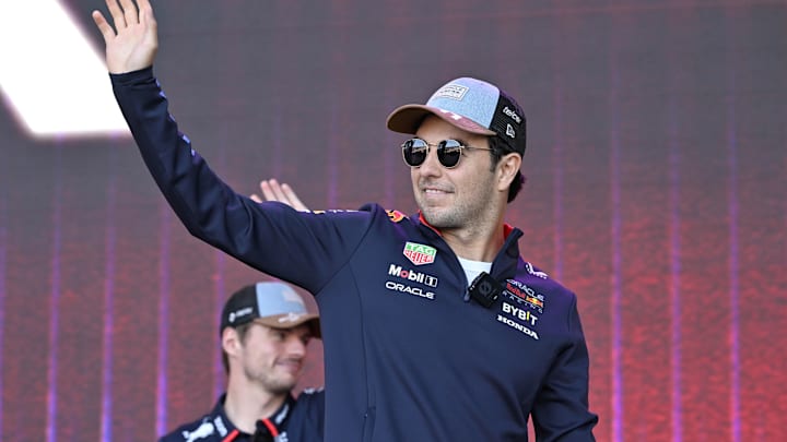 Oct 19, 2024; Austin, Texas, USA; Oracle Red Bull Racing driver Sergio Perez (11) of Team Mexico waves to the crowd during a fan forum before the Sprint Race in the 2024 Formula One US Grand Prix at Circuit of the Americas. Mandatory Credit: Jerome Miron-Imagn Images