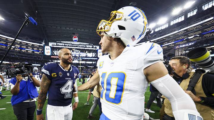 Dec 21, 2025; Arlington, Texas, USA; Dallas Cowboys quarterback Dak Prescott (4) and Los Angeles Chargers quarterback Justin Herbert (10) greet each other following a Chargers victory at AT&T Stadium. Mandatory Credit: Kevin Jairaj-Imagn Images