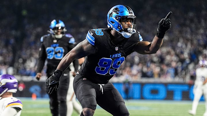 Detroit Lions defensive end Za'Darius Smith (99) celebrates a sack against Minnesota Vikings quarterback Sam Darnold (14)