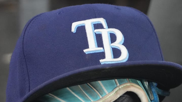Sep 26, 2025; Toronto, Ontario, CAN; The hat and glove of Tampa Bay Rays third baseman Junior Caminero (13) in the dugout during the game against the Toronto Blue Jays at Rogers Centre. 