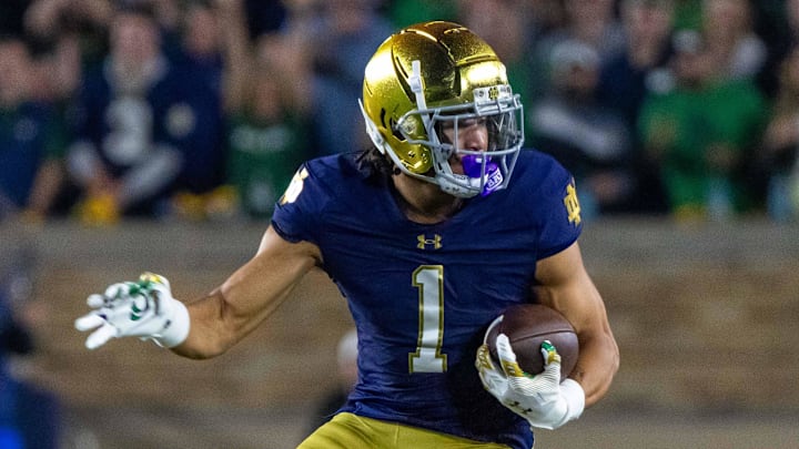 Sep 13, 2025; South Bend, Indiana, USA; Notre Dame Fighting Irish wide receiver Jaden Greathouse (1) runs with the ball during the second half against the Texas A&M Aggies at Notre Dame Stadium. Sep 13, 2025; South Bend, Indiana, USA; Notre Dame Fighting Irish wide receiver Jaden Greathouse (1) runs with the ball during the second half against the Texas A&M Aggies at Notre Dame Stadium.