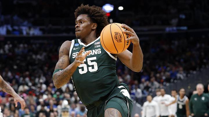 Mar 27, 2026; Washington, DC, USA;Michigan State Spartans forward Coen Carr (55) dribbles the ball against the UConn Huskies in the first half during a Sweet Sixteen game of the East Regional of the men's 2026 NCAA Tournament at Capital One Arena. Mandatory Credit: Amber Searls-Imagn Images