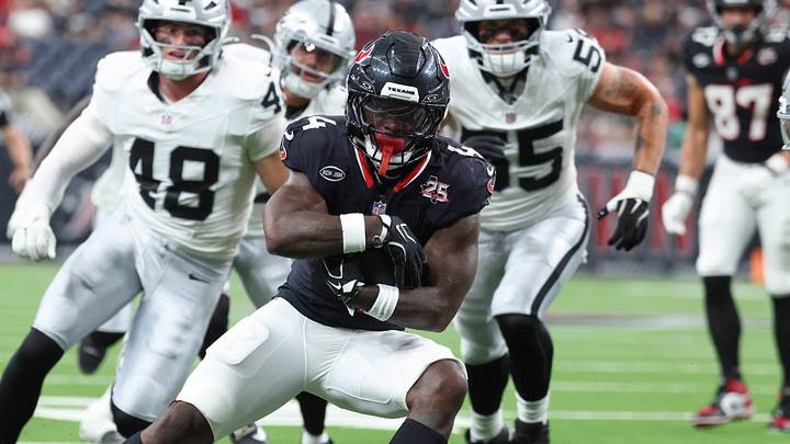 Aug 20, 2026; Houston, Texas, USA;  Houston Texans running back Woody Marks (4) runs with the ball and scores a touchdown during the game against the Las Vegas Raiders at Reliant Stadium. Mandatory Credit: Troy Taormina-Imagn Images