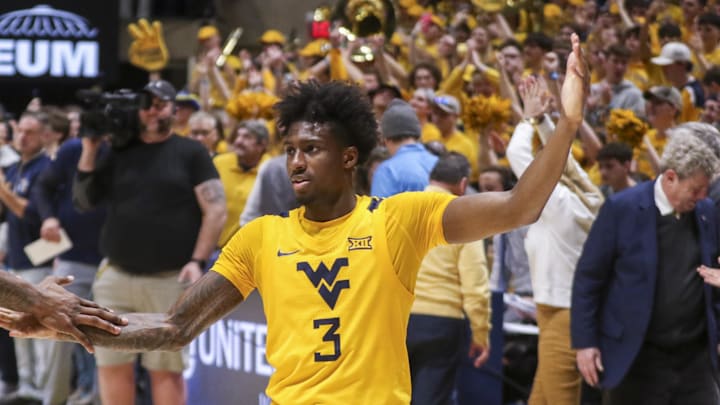 Jan 10, 2026; Morgantown, West Virginia, USA; West Virginia Mountaineers guard Honor Huff (3) celebrates after defeating the Kansas Jayhawks at Hope Coliseum. Mandatory Credit: Ben Queen-Imagn Images