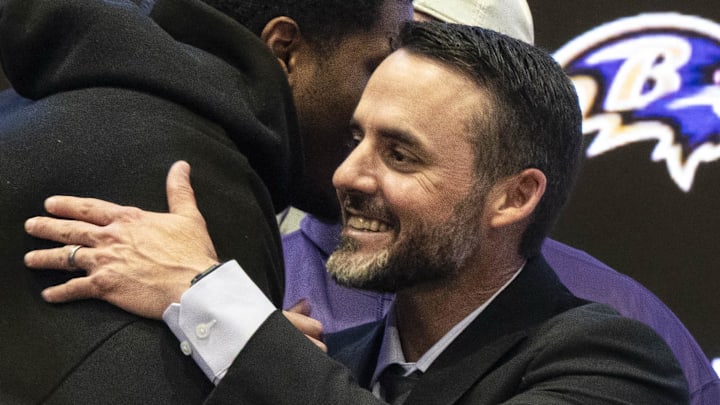 Jan 29, 2026; Owings Mills, MD, USA; Jesse Minter hugs players after meeting at Under Armour Performance Center. Mandatory Credit: Lexi Thompson-Imagn Images