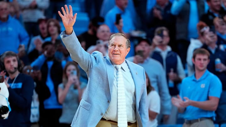 Dec 14, 2024; Chapel Hill, North Carolina, USA; North Carolina Tar Heels head football coach Bill Belichick is introduced during half time at Dean E. Smith Center. Mandatory Credit: Bob Donnan-Imagn Images Dec 14, 2024; Chapel Hill, North Carolina, USA; North Carolina Tar Heels head football coach Bill Belichick is introduced during half time at Dean E. Smith Center. Mandatory Credit: Bob Donnan-Imagn Images