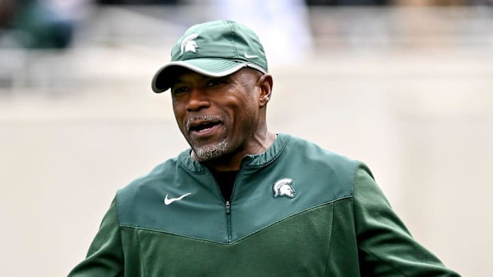 Michigan State's Michigan State's wide receivers coach Courtney Hawkins, right, talks with Jaden Mangham during the Spring Showcase on Saturday, April 20, 2024, at Spartan Stadium in East Lansing. Michigan State's Michigan State's wide receivers coach Courtney Hawkins, right, talks with Jaden Mangham during the Spring Showcase on Saturday, April 20, 2024, at Spartan Stadium in East Lansing.