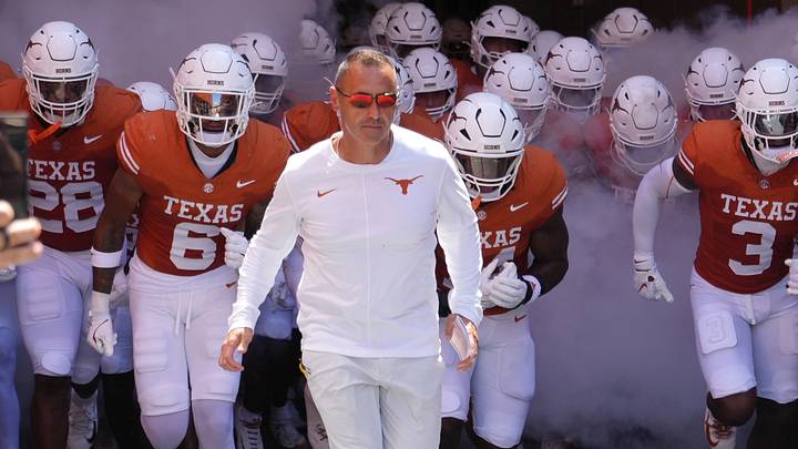Texas Longhorns Head Coach Steve Sarkisian leads his team on to the field before a game against the Texas State Bobcats. Texas Longhorns Head Coach Steve Sarkisian leads his team on to the field before a game against the Texas State Bobcats.