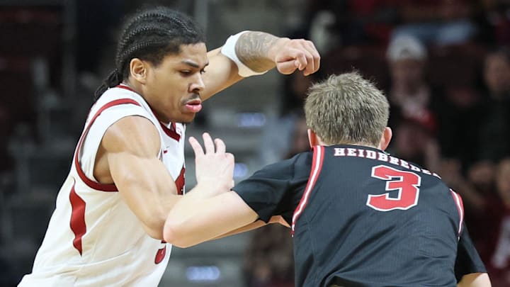 Arkansas Razorbacks guard Darius Acuff Jr (5) defends during the second half against Fresno State Bulldogs guard Jake Heidbreder (3) at Simmons Bank Arena in North Little Rock, Ark. Arkansas Razorbacks guard Darius Acuff Jr (5) defends during the second half against Fresno State Bulldogs guard Jake Heidbreder (3) at Simmons Bank Arena in North Little Rock, Ark.