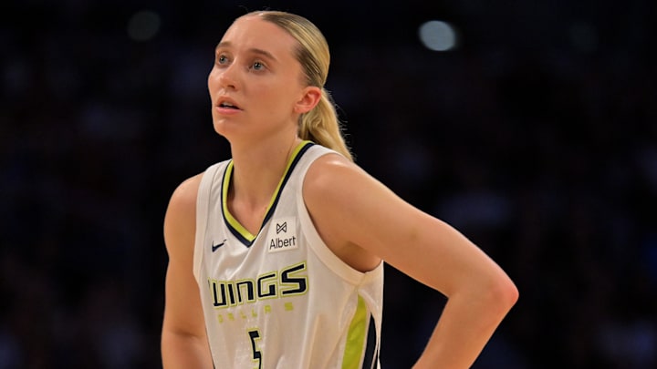 Sep 7, 2025; Los Angeles, California, USA;  Dallas Wings guard Paige Bueckers (5) looks on during the first half against the Los Angeles Sparks at Crypto.com Arena. Mandatory Credit: Jayne Kamin-Oncea-Imagn Images