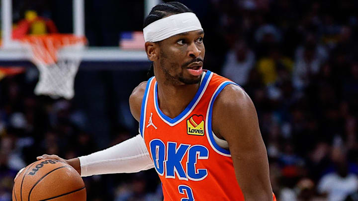 Feb 1, 2026; Denver, Colorado, USA; Oklahoma City Thunder guard Shai Gilgeous-Alexander (2) controls the ball as Denver Nuggets guard Jalen Pickett (24) guards in the first quarter at Ball Arena. Mandatory Credit: Isaiah J. Downing-Imagn Images