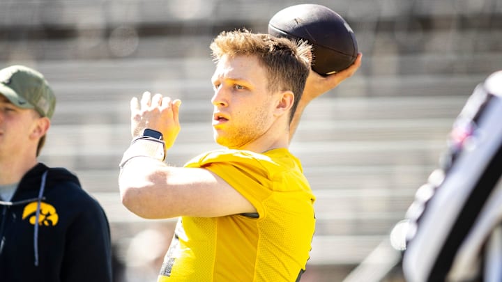 Apr 26, 2025; Iowa City, IA, USA; Iowa quarterback Mark Gronowski (11) throws during a spring NCAA football open practice at Kinnick Stadium. Mandatory Credit: Joseph Cress-The Des Moines Register