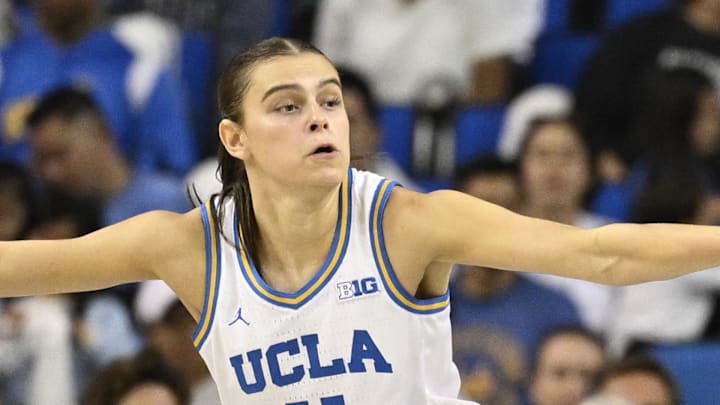 Nov 24, 2024; Los Angeles, California, USA; UCLA Bruins guard Gabriela Jaquez (11) knocks the ball away from South Carolina Gamecocks forward Chloe Kitts (21) during the second quarter at Pauley Pavilion presented by Wescom. Right is UCLA Bruins guard Kiki Rice (1). Mandatory Credit: Robert Hanashiro-Imagn Images