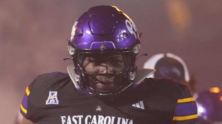 Oct 16, 2025; Greenville, North Carolina, USA;  East Carolina Pirates offensive lineman Jimarion McCrimon (62) runs out onto the field before the start of the game against the Tulsa Golden Hurricane at Dowdy-Ficklen Stadium. Mandatory Credit: James Guillory-Imagn Images