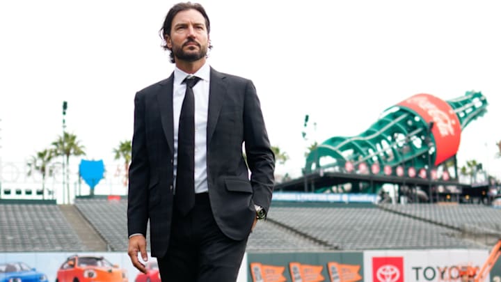 Tony Vitello dressed nicely ahead of introductory press conference