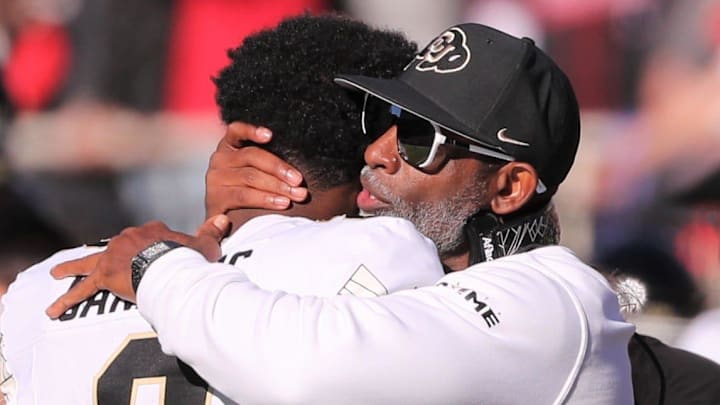 Colorado football coach Deion Sanders hugs his son, Shedeur Sanders, before facing Texas Tech in a Big 12 football game Saturday, Nov. 9, 2024, at Jones AT&T Stadium. Colorado football coach Deion Sanders hugs his son, Shedeur Sanders, before facing Texas Tech in a Big 12 football game Saturday, Nov. 9, 2024, at Jones AT&T Stadium.